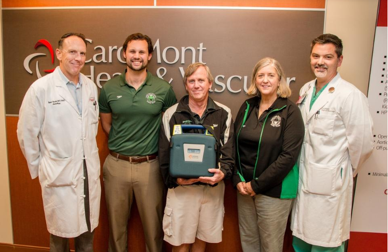 CaroMont Health donates life-saving equipment to local swim team